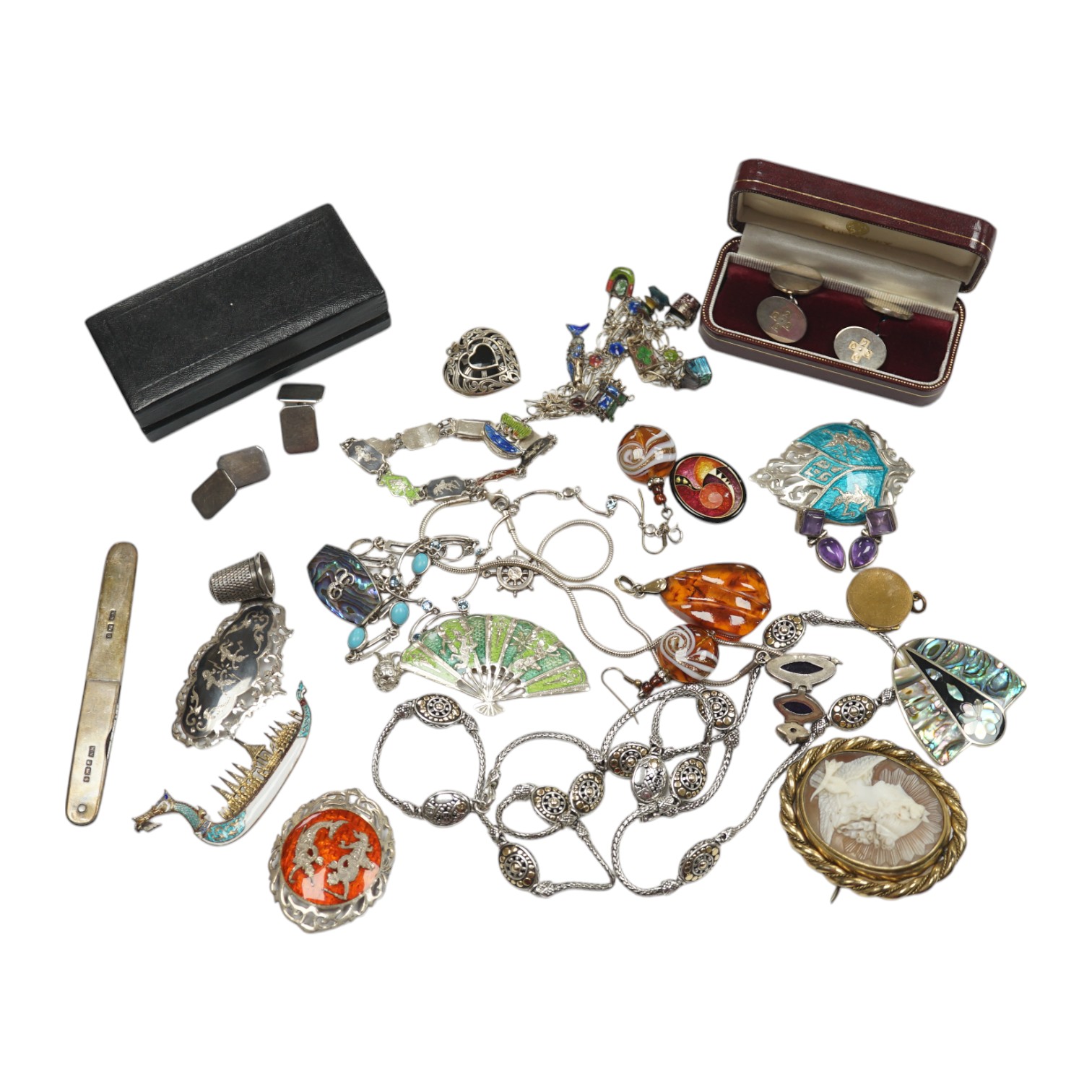 Assorted sterling , white metal and enamel jewellery including a charm bracelet, Siamese brooches, 925 and yellow metal necklace, etc. Condition - poor to fair to good